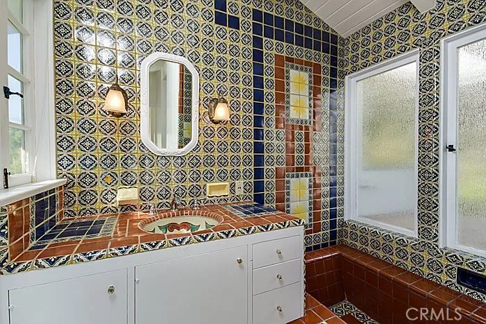 This is the master bathroom, with the classic Spanish Revival influence.