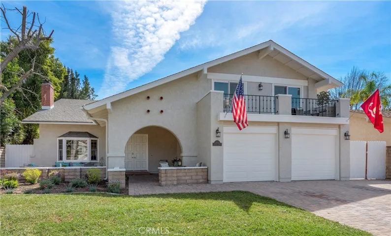 Front View of the home with patio and Lounge Area