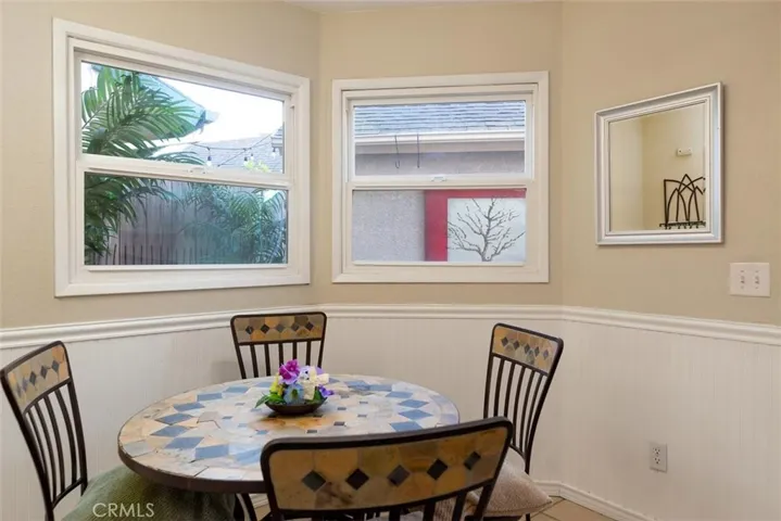 Sun room just around the corner from the kitchen and laundry area.