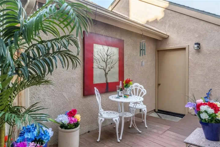 Back patio with a door to the garage.