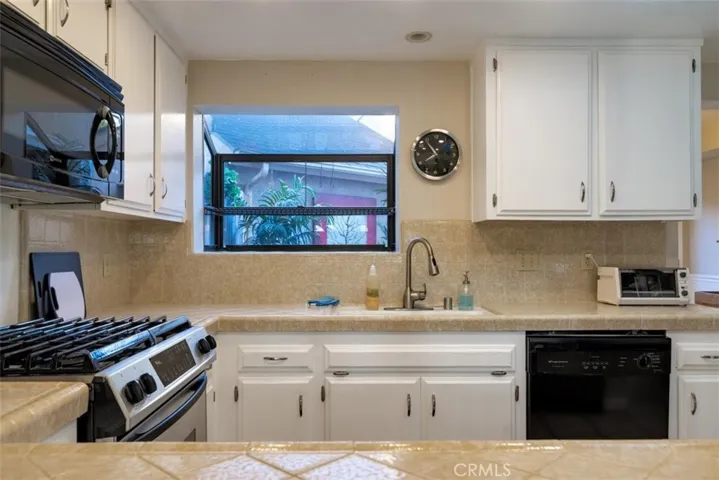 Looking into the kitchen from the hall laundry closet.