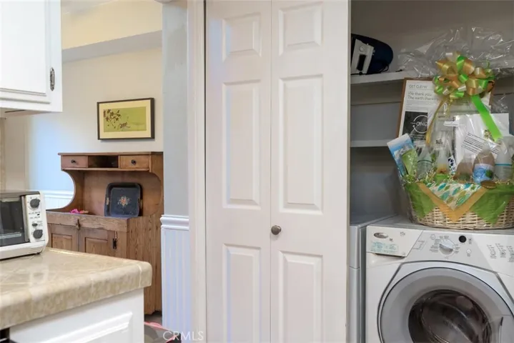 Washer and dryer conveniently located right across from the kitchen.