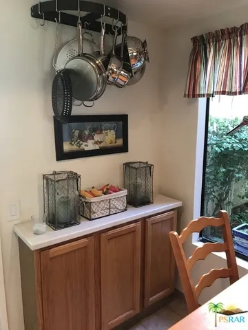 Kitchen window overlooks garden courtyar