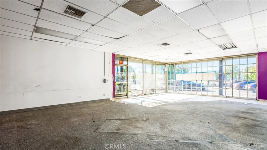 This is the main room with private office and bathroom and rear exit for employees.