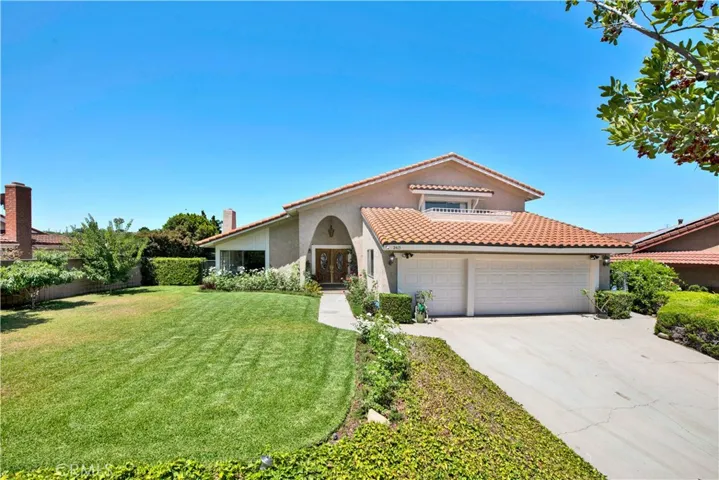 Imagine being able to pull into this large driveway and see your large front lawn surrounded by tons of roses