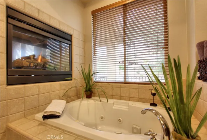 Beautiful large Jacuzzi tub with a fireplace.