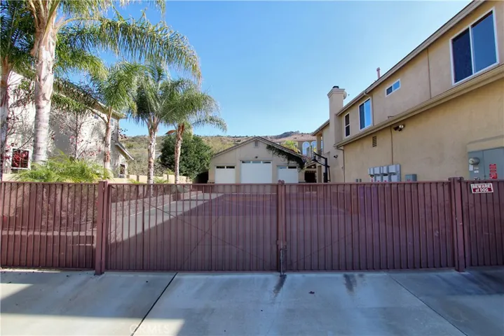 Nice large dual iron gate entry to the backyard.  Nice the 1/2 basketball court?  The house has 69 solar panels with 4 inverters.  Generates approximately 28000 kilowatts a year.