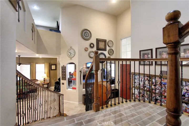 View looking towards the front door, game room and living room from the landing.