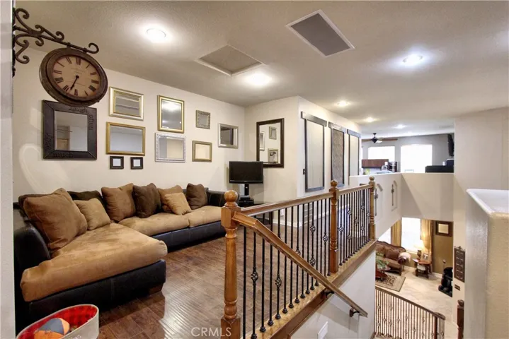Sitting area at the top of the stairs leading to the loft.