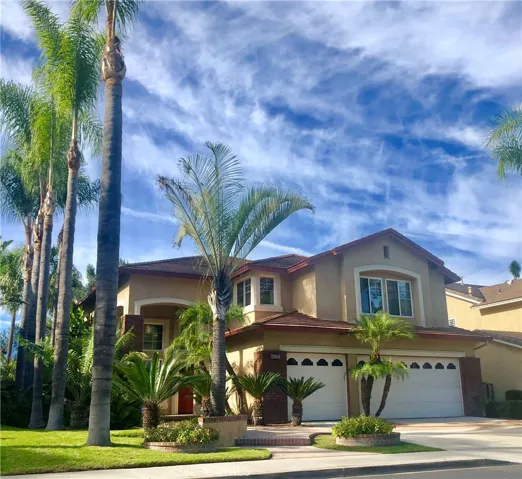 Manicured tropical landscape provides great curb appeal on this single-loaded culdesac.