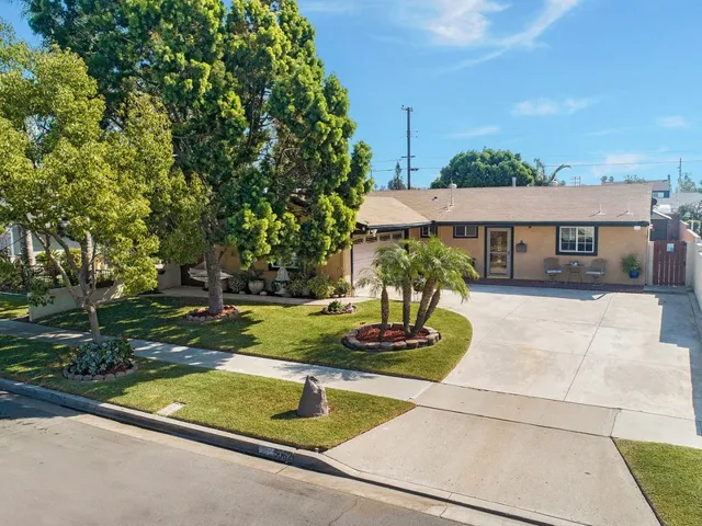 Excellent curb appeal with newer expanded driveway.