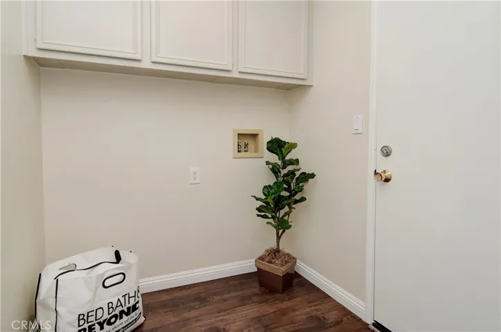 Convenient inside laundry room has cabinetry and access to oversize garage.
