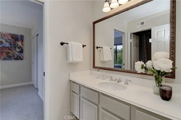Jack and Jill bath has plenty of storage and counter space to share.