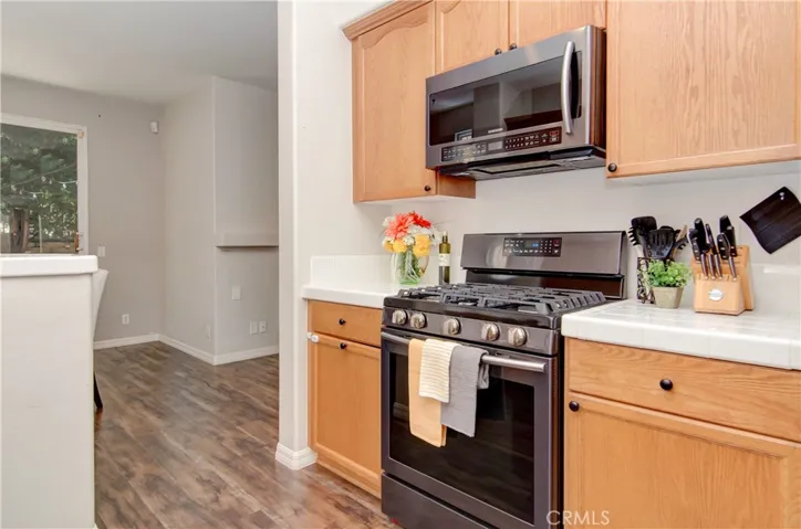 Clean and sleek kitchen that opens to living area.