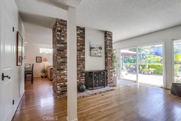 Living room facing towards family room and remodeled eat in kitchen