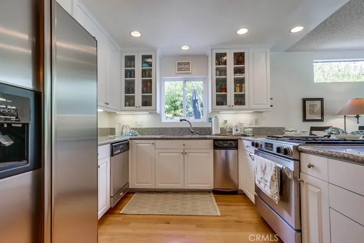 Great remodeled kitchen with showcase cabinets and stainless appliances