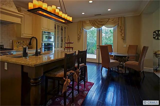 Informal dining with French doors to rear terrace and yard