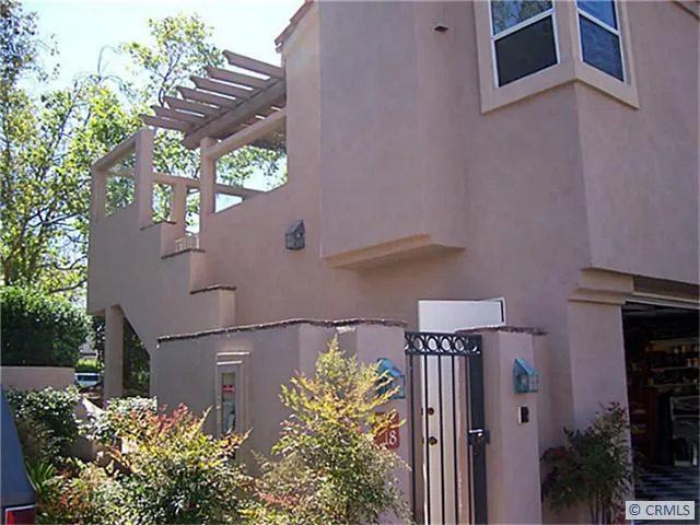 Private end unit with no one above or below. Gated entrance with 2 car attached garage and small yard.
