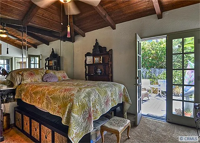 The master bedroom with French doors to back patio/deck