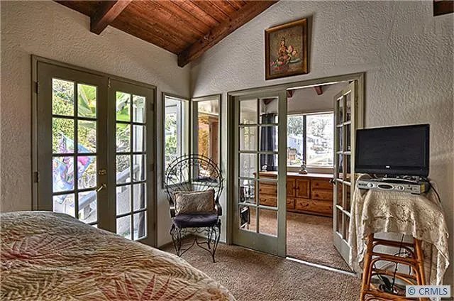 The master bedroom has French doors to the 2nd bedroom, which may also be used as an office.  (The 2nd bedroom has another access door from the living room, so this door connecting the two bedrooms could be covered.)