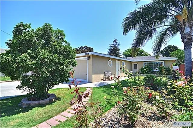 Wonderful curb appeal with lush landscape and deep setback.