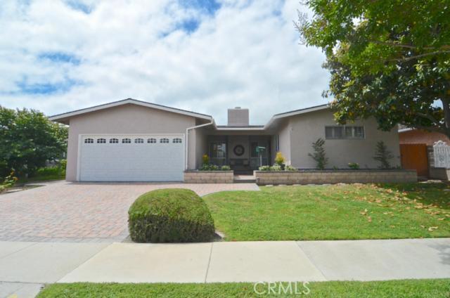 Gorgeous curb appeal features paver stone hardscape, fresh paint, mature trees and plenty of space for fun in the front yard.