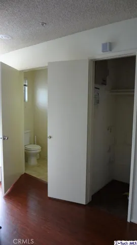 1/4 bathroom in main entrance with ADT home alarm system in Closet