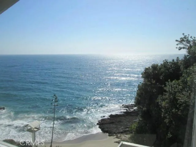 From the living room and the deck you can see the waves hit the beach and the rocks.