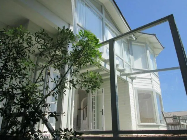 This view is from the lower patio to show the ocean side of the exterior of the home.