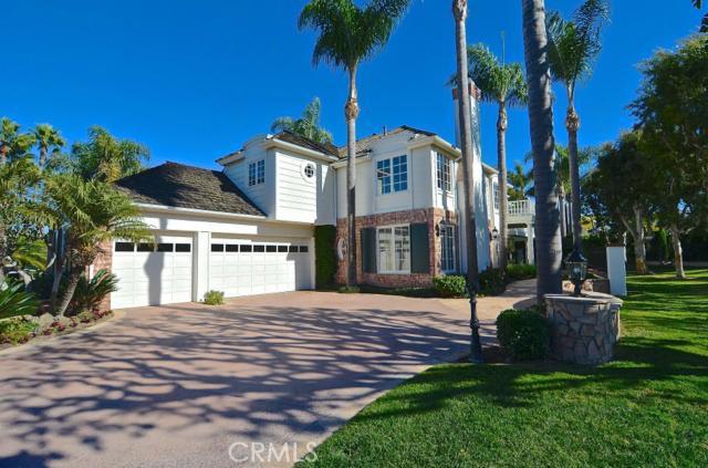 Palm studded drive and green space galore create the backdrop for this one of a kind home.