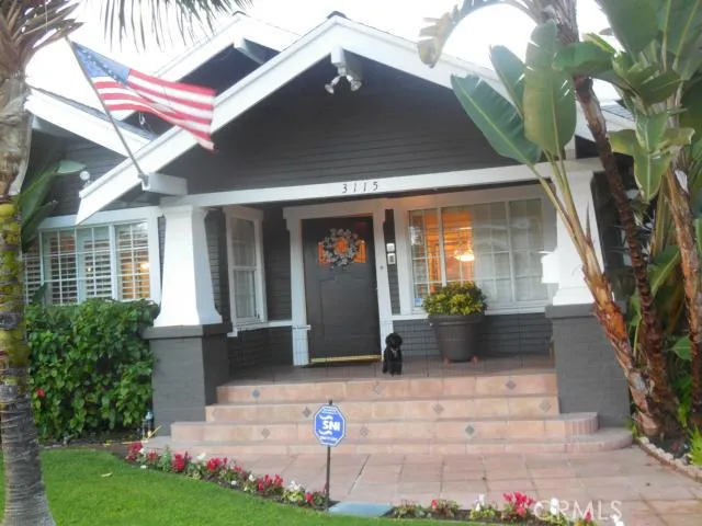 Front porch with antique oak door and manicure lawn