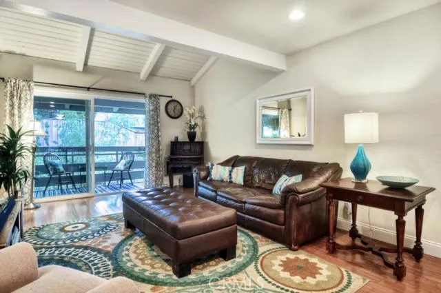 Family room with large 2nd balcony opening up to trees greenbelt.