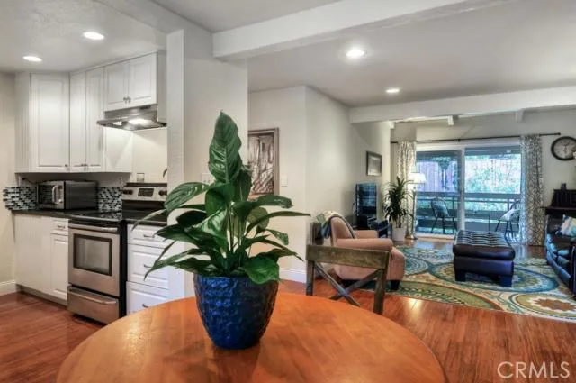 View of the dining room, opening up to the kitchen and family room.