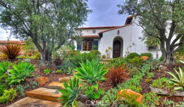 Spanish estate in Covenant Hills with lush landscaping