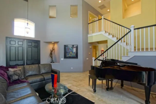 LIVING ROOM WITH ENOUGH SPACE FOR A BABY GRAND PIANO