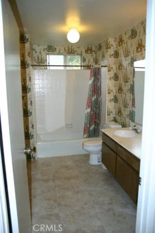 Upstairs hall bath has dual sinks and tub/shower combo and new tile floor