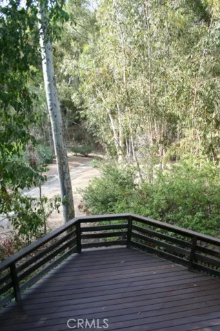Looking into the forest from the master bedroom deck with deck below from family and dining room