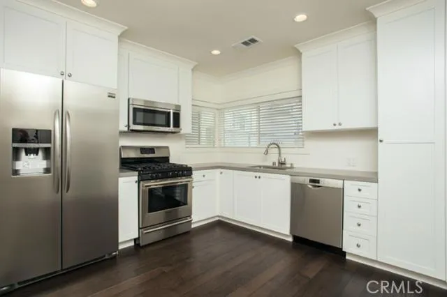 Kitchen with all stainless appliances ... completely remodeled with beautiful new wood flooring