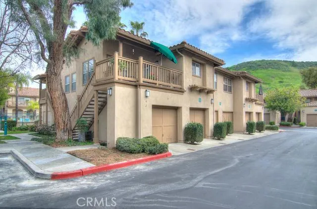 Beautiful Mission Style architecture enhances this popular carriage unit...no one above or below!