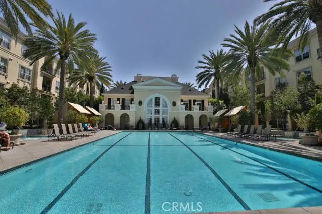 Gorgeous pool with palm trees and cabanas