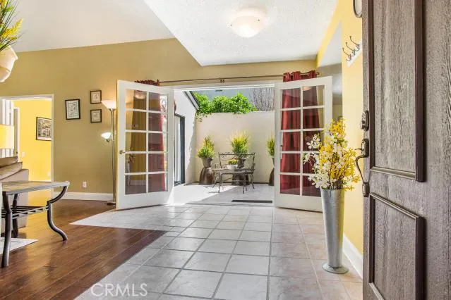 Upon entry french doors to outdoor atrium area