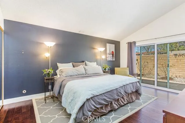 Master Bedroom with sliding doors leading to backyard