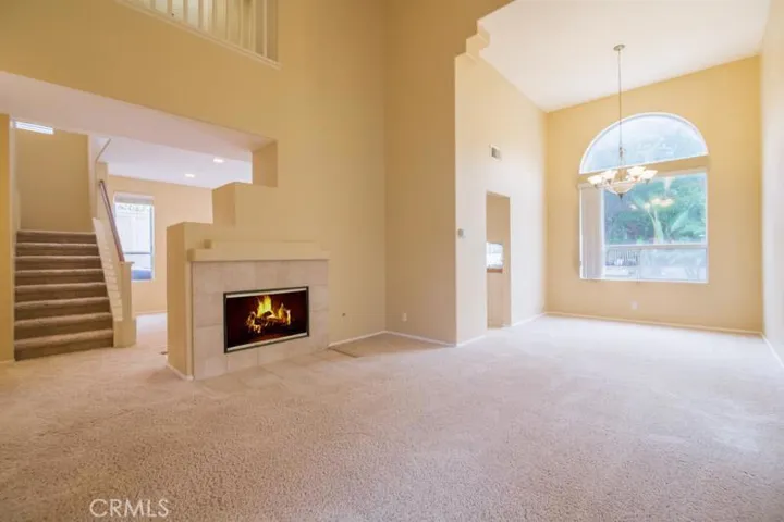 Desired Open Floor Plan with Vaulted Ceilings and Dual Sided Fireplace, Dining Room with Views to Backyard
