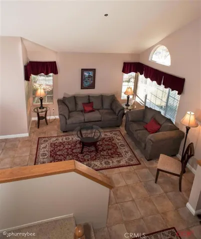 From the stairs looking down into the living room