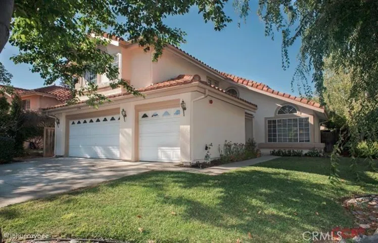 Another front view of home. Corner lot and sits back from street