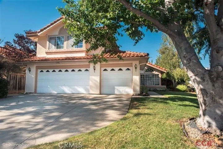 3-Car Attached garage. Beautiful healthy oak tree