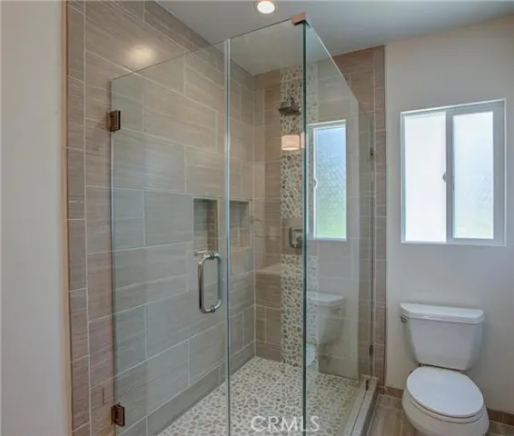 Master bath with custom tile work.