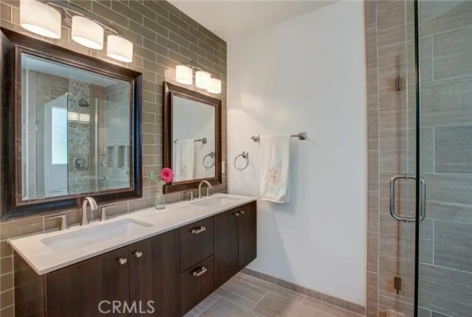 Master bath with custom tile work.