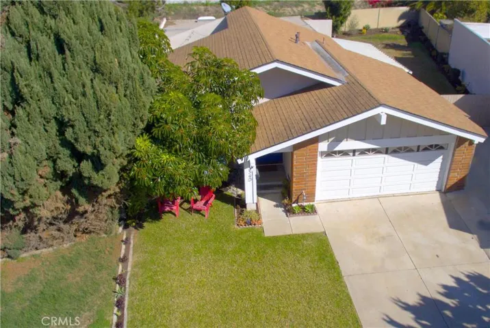 Beautiful aerial shot of the front of the home. Lounge in style on this front yard.