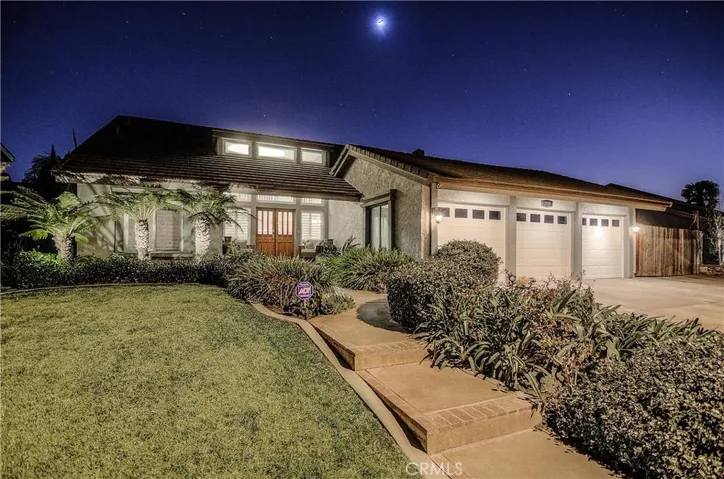 Welcome! Deep setback from street showcases lush landscape and the oversize lot. Step up to the inviting front porch with double door entry, and get ready to be wowed.